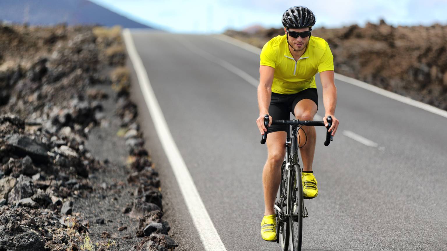 A person wearing sunglasses while riding cycle