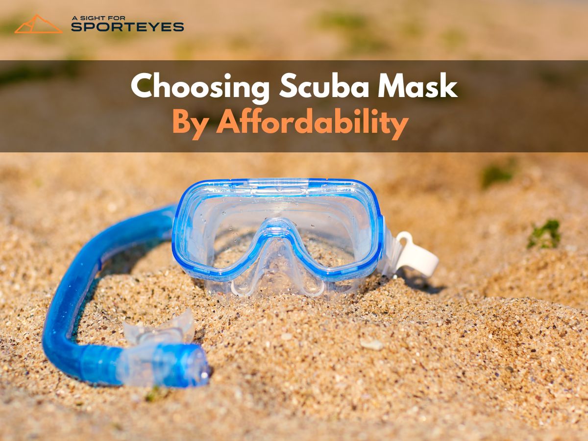 a scuba mask lying near on sand