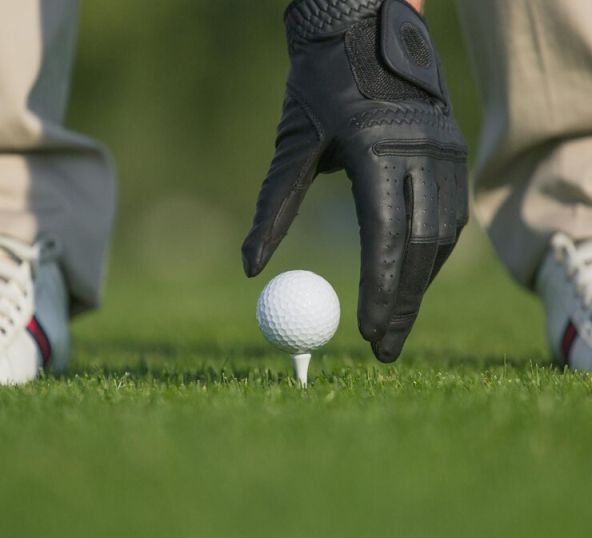  person with Golf glove & ball