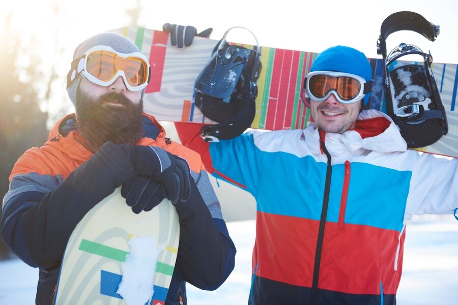 Two men Standing on Snow wearing Ski Goggles