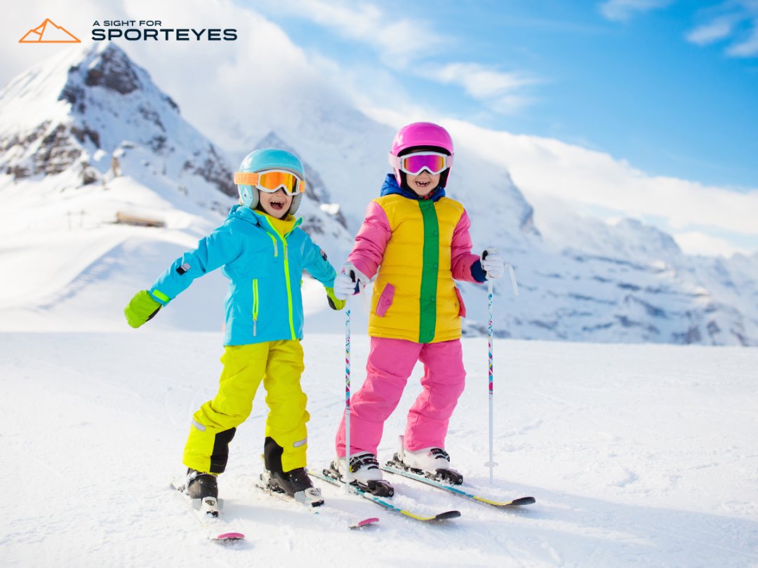 Kids with ski goggles on snowy mountain