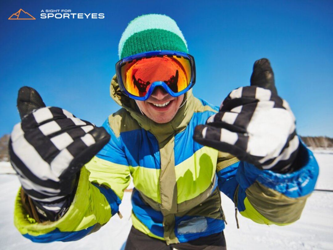 Mens with ski goggles on snowy mountain