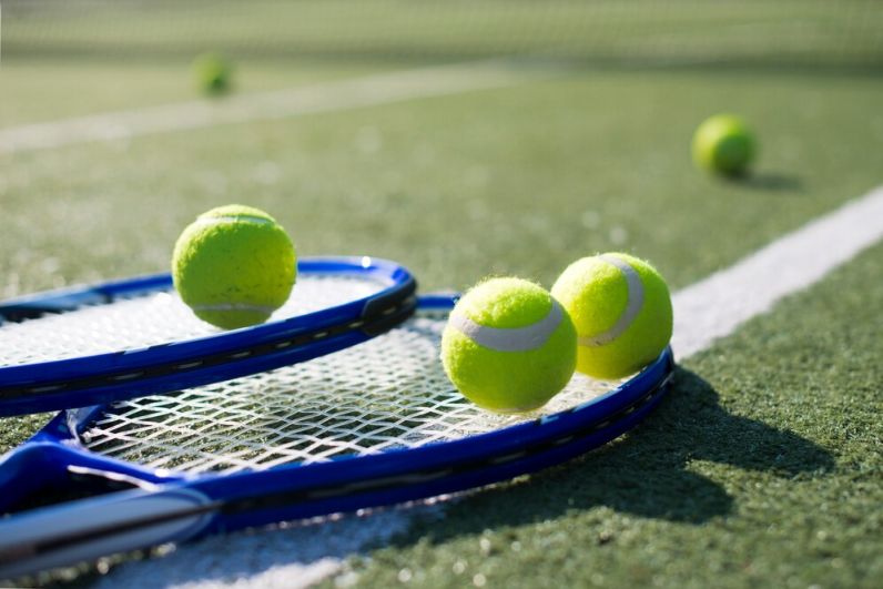 Image of tennis racket and balls