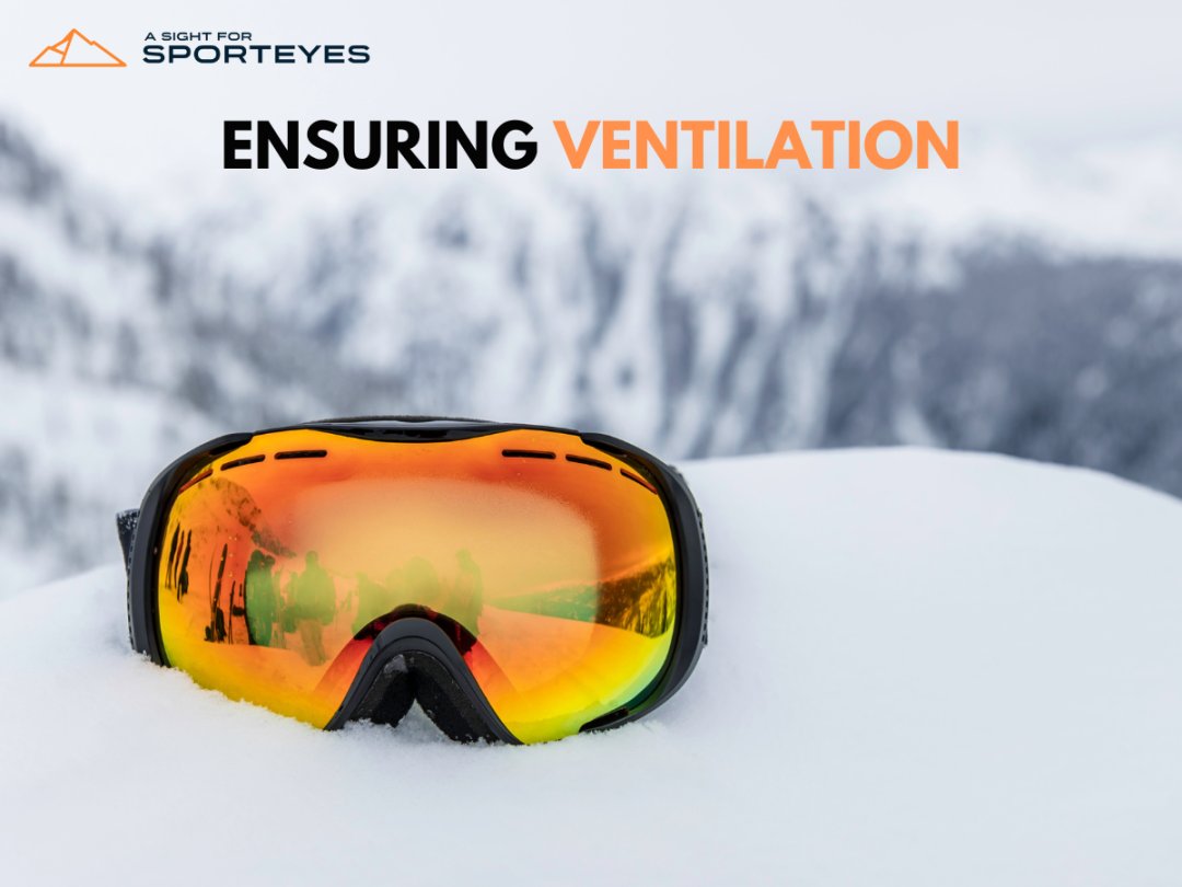  Ski goggles on snow highlighting ventilation feature with mountainous background