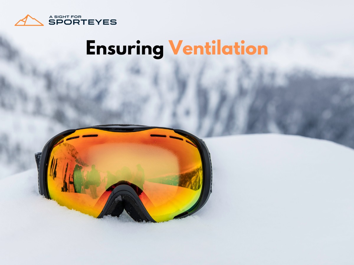Ski goggles on snow highlighting ventilation feature with mountainous background