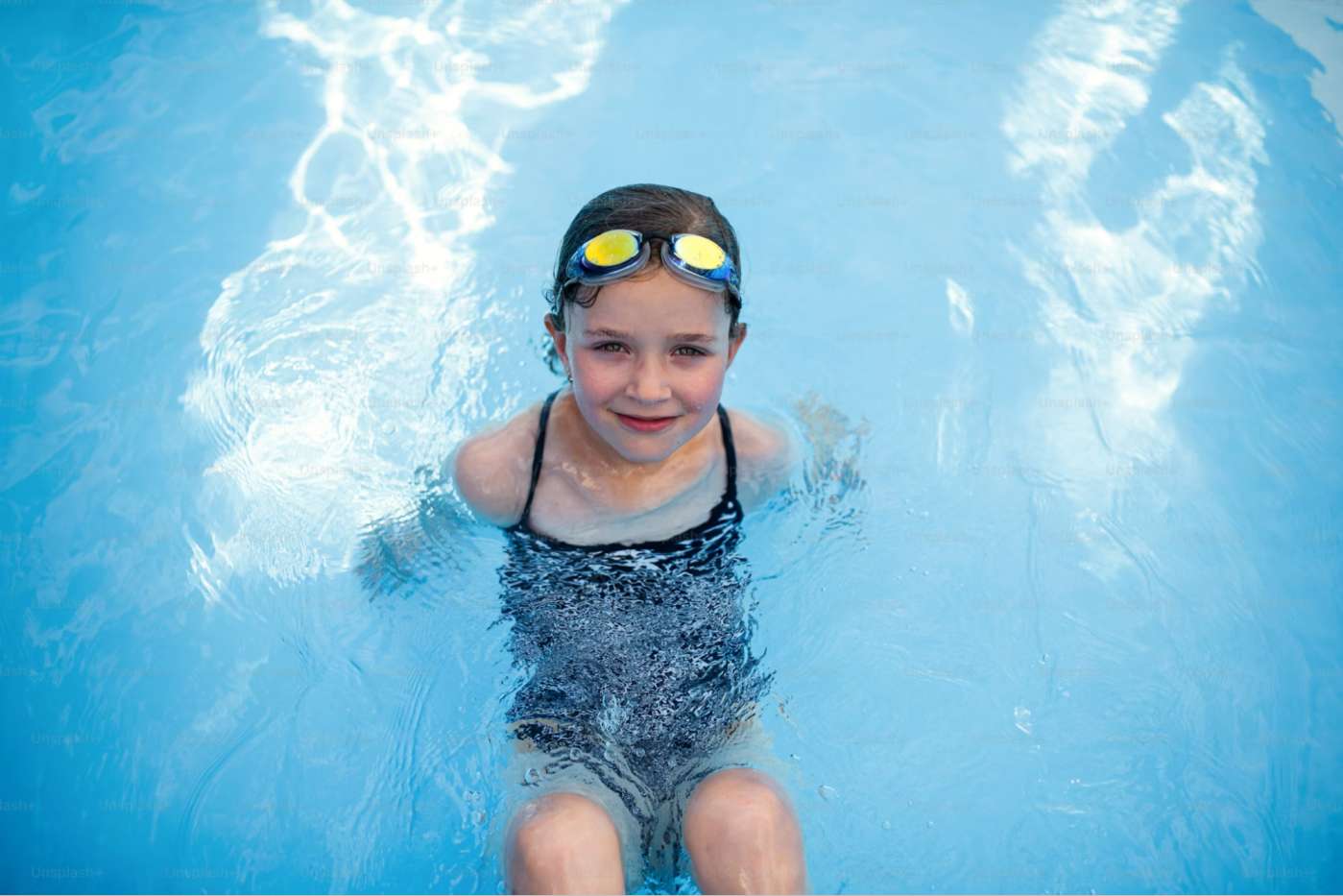 Small Girl Wearing Swimming Goggles